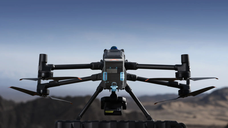Front view of the DJI Matrice 400 with AP100 Parachute mounted, showing dual redundant safety highlights